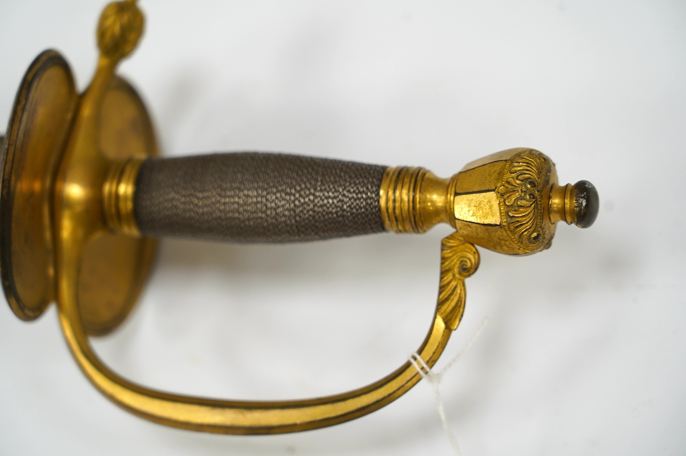 A 1796 pattern infantry officer's sword, blued and gilt blade, etched with crowned GR and Royal Arms, regulation gilt brass hilt, in its leather scabbard with brass mounts, locket signed S. Brunn, 81.5cm. Condition - goo